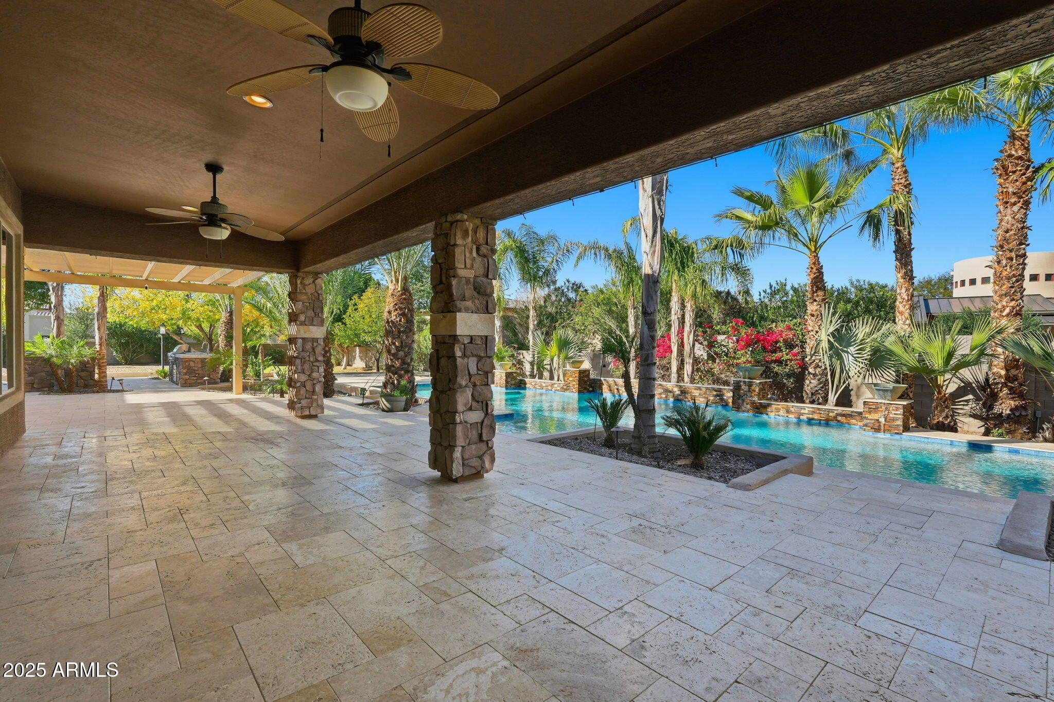 2218 East Brooks Farm Road Gilbert, AZ 85298 - Photo 47 of 55 a view of a patio with a table and chairs