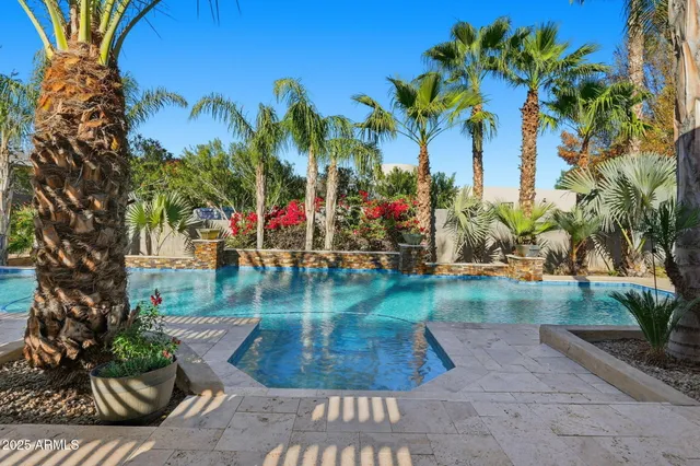 a backyard of a house with lots of green space and mountain view