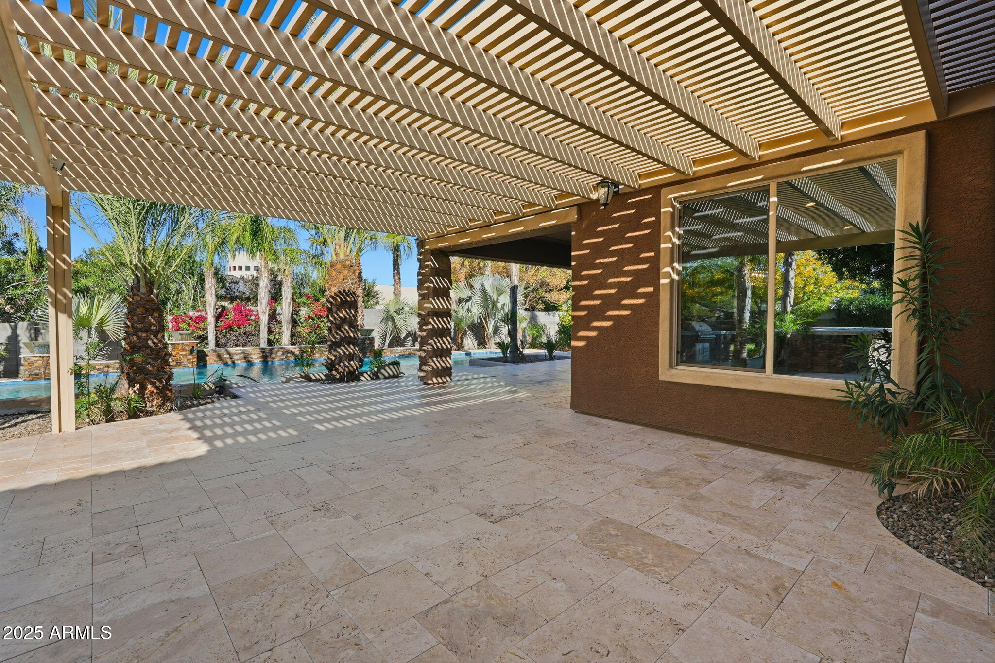 2218 East Brooks Farm Road Gilbert, AZ 85298 - Photo 50 of 55 a view of a patio with table and chairs