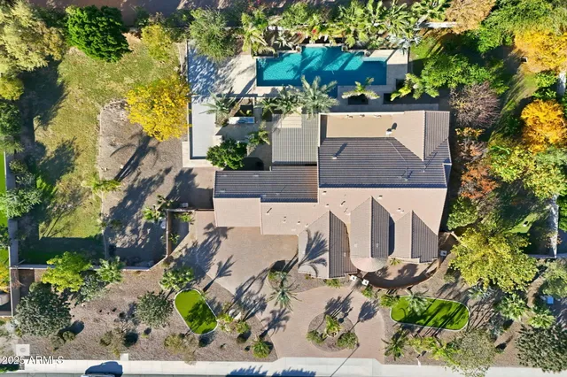 an aerial view of a house with a garden
