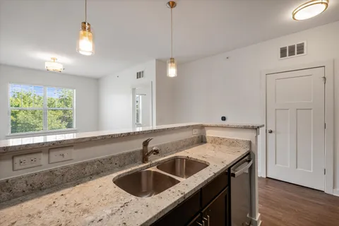 a kitchen with a sink and a window