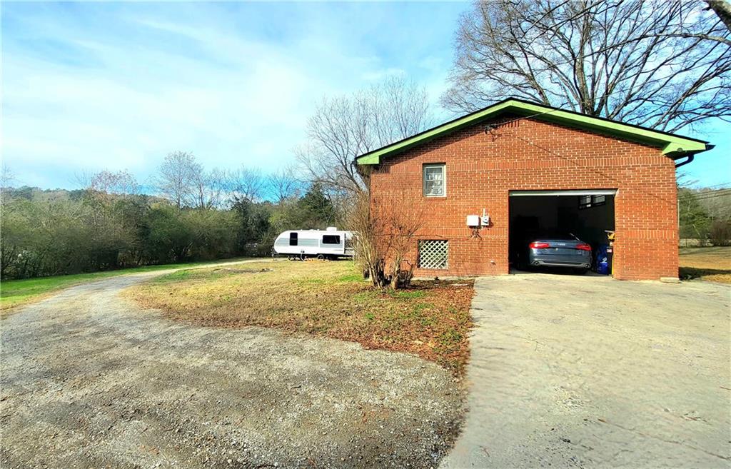 2070 Kingston Highway Rome, GA 30161 - Photo 2 of 48 a view of a house with backyard and a garden