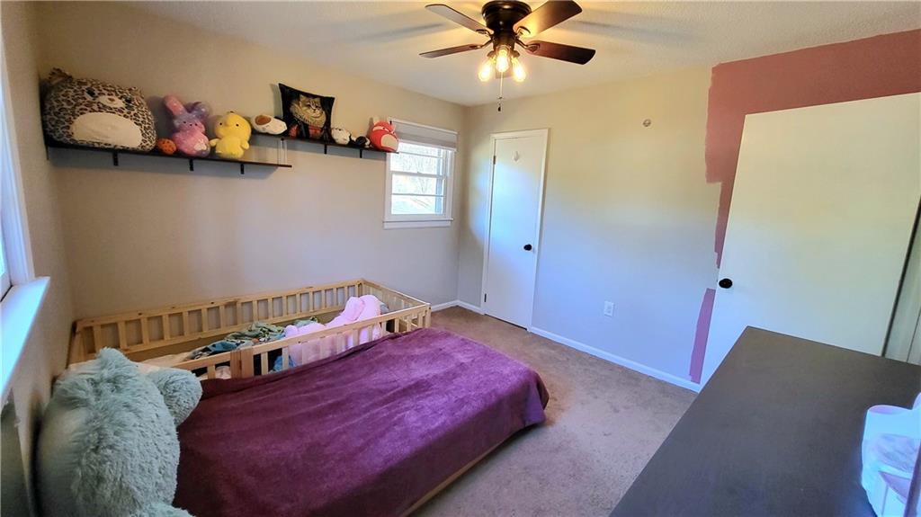 2070 Kingston Highway Rome, GA 30161 - Photo 22 of 48 a bedroom with a bed and cabinets