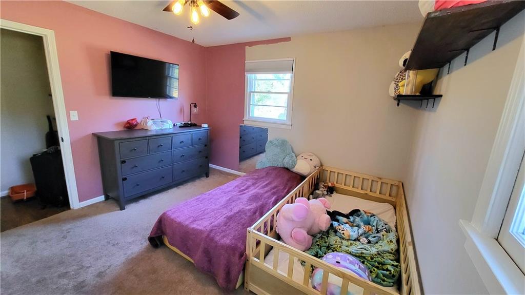 2070 Kingston Highway Rome, GA 30161 - Photo 23 of 48 a bedroom with a bed and flat screen tv