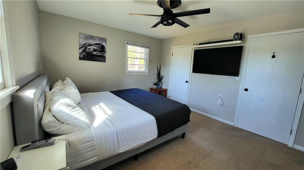 2070 Kingston Highway Rome, GA 30161 - Photo 24 of 48 a bedroom with a bed and a flat screen tv