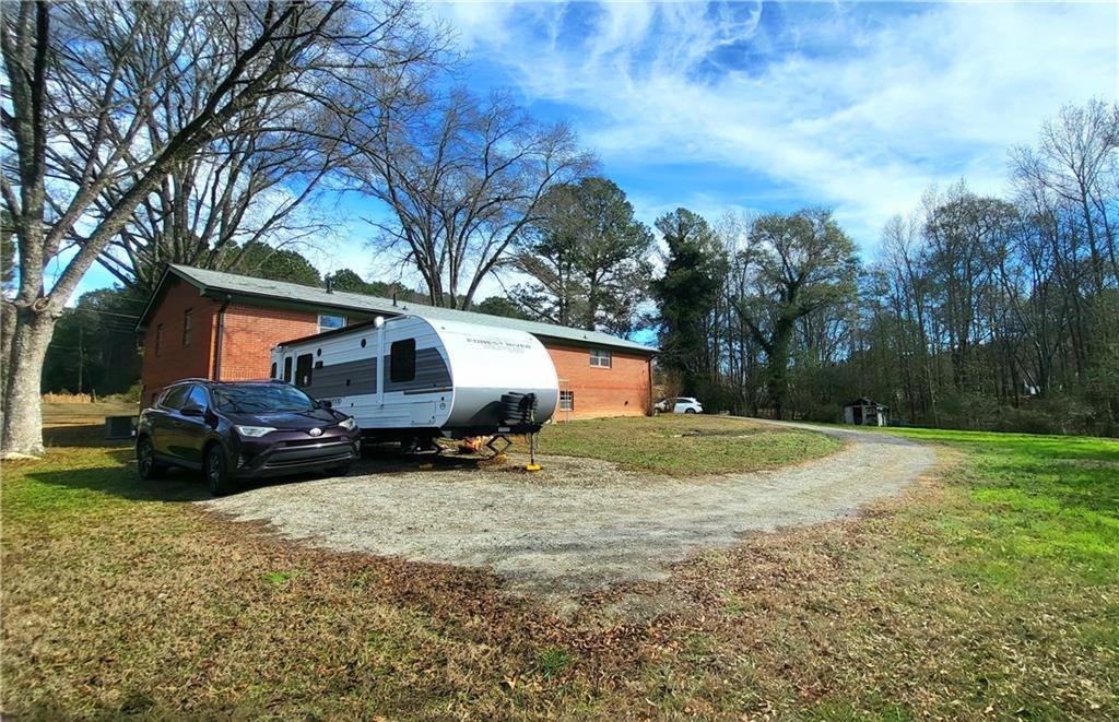2070 Kingston Highway Rome, GA 30161 - Photo 3 of 48 a house that has a tree in front of it