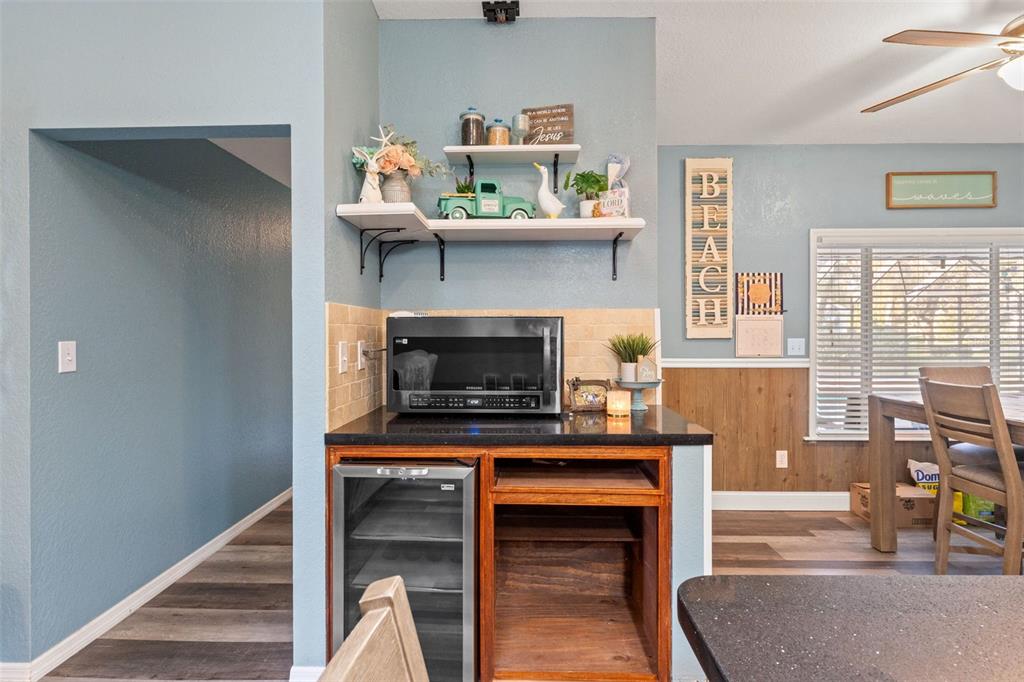 7180 Royal Oak Drive Spring Hill, FL 34607 - Photo 15 of 42 a living room with furniture and a fireplace