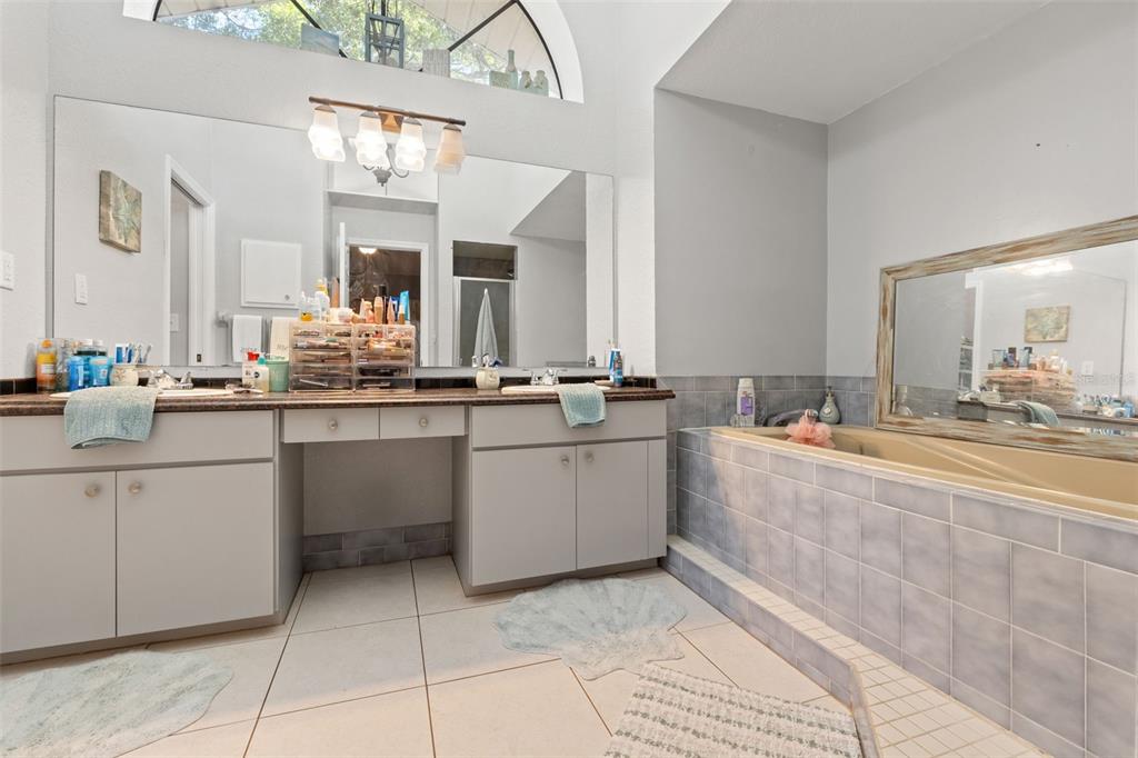 7180 Royal Oak Drive Spring Hill, FL 34607 - Photo 22 of 42 a bathroom with a sink vanity and mirror