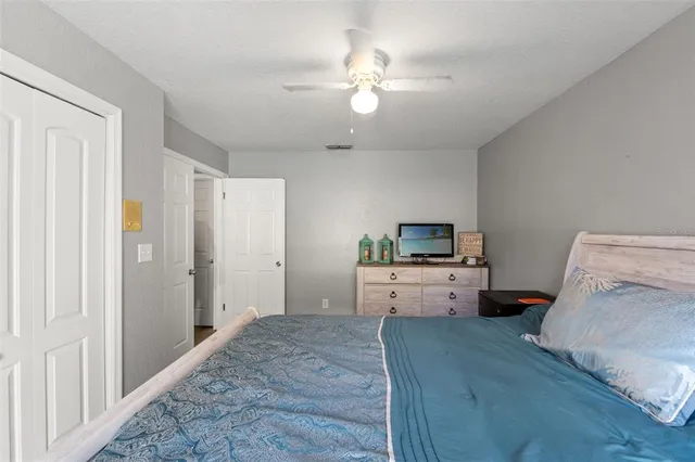 a room with a bed and a chandelier