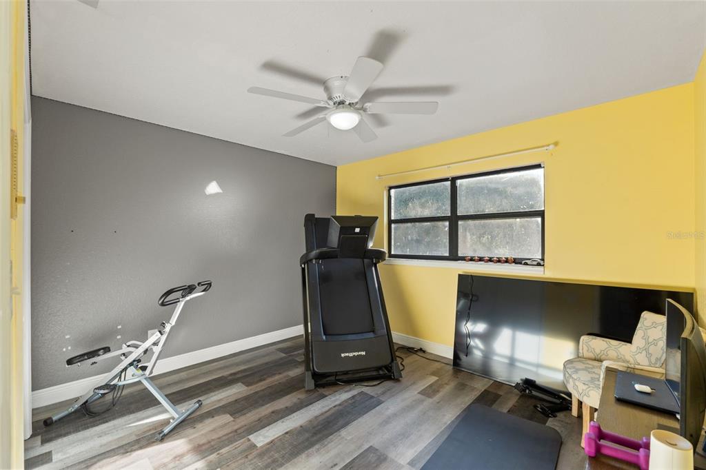 7180 Royal Oak Drive Spring Hill, FL 34607 - Photo 30 of 42 a room with a window and gym equipment