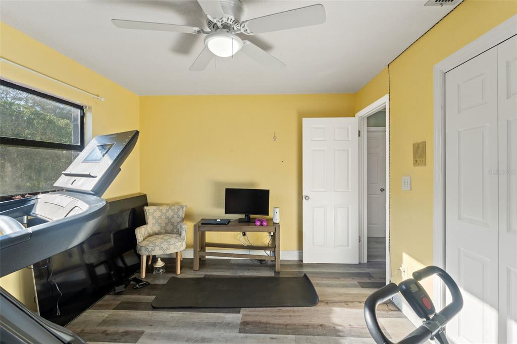 7180 Royal Oak Drive Spring Hill, FL 34607 - Photo 31 of 42 a living room with furniture and wooden floor