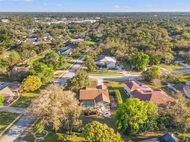 an aerial view of residential houses with outdoor space