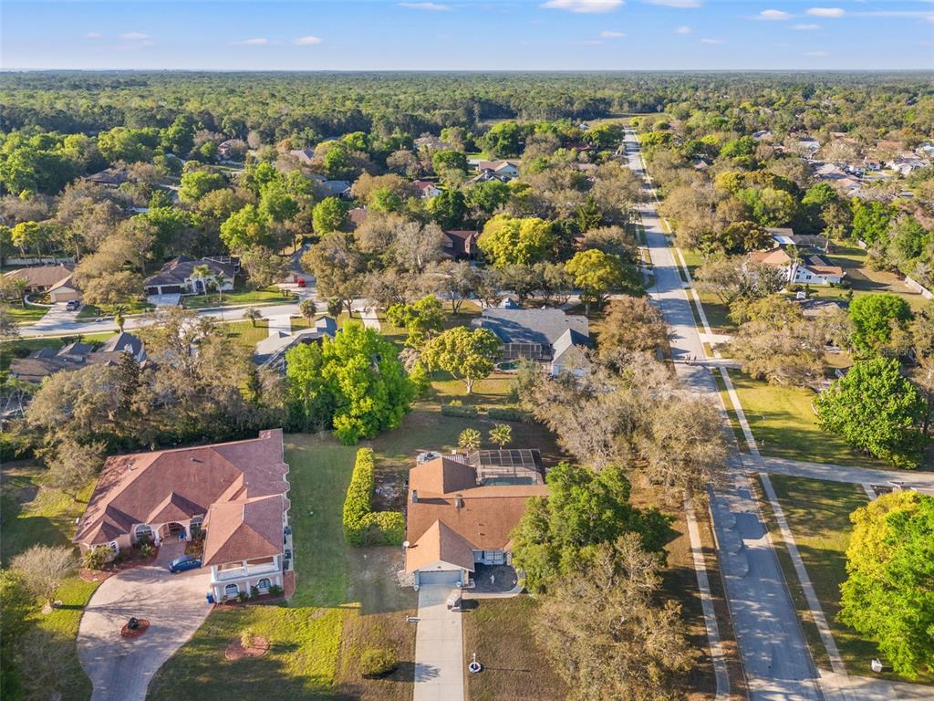 7180 Royal Oak Drive Spring Hill, FL 34607 - Photo 42 of 42 an aerial view of residential houses with outdoor space and parking
