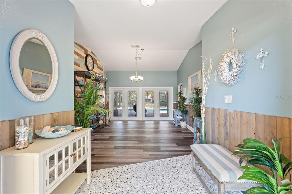 7180 Royal Oak Drive Spring Hill, FL 34607 - Photo 5 of 42 a lobby with a table and chairs