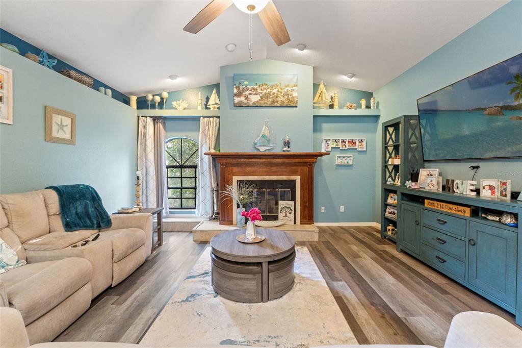 7180 Royal Oak Drive Spring Hill, FL 34607 - Photo 6 of 42 a living room with furniture and a fireplace