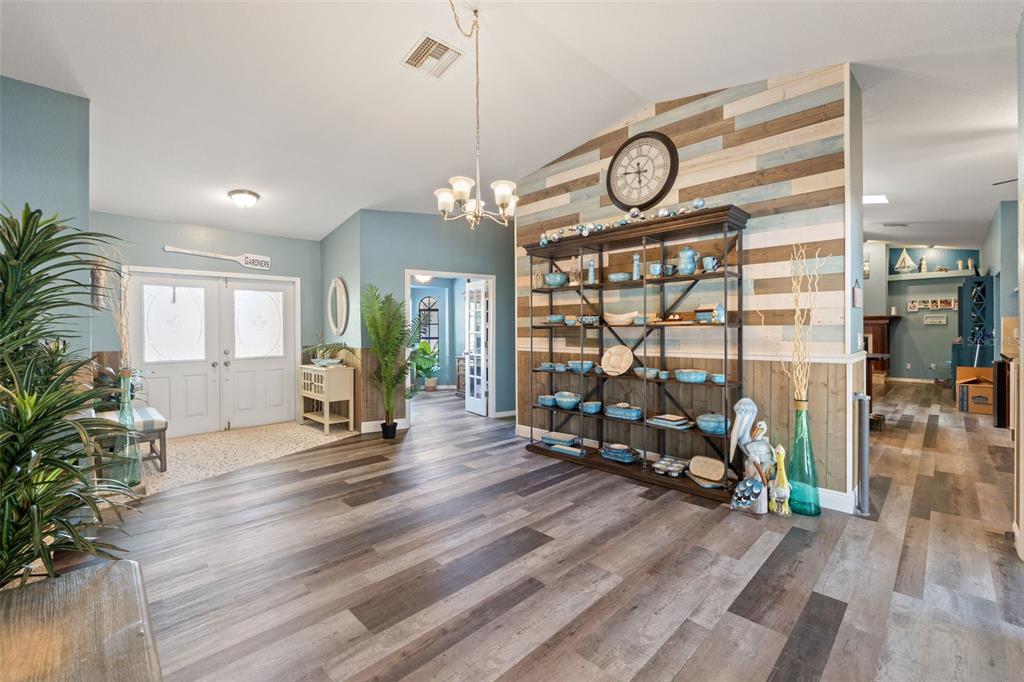 7180 Royal Oak Drive Spring Hill, FL 34607 - Photo 7 of 42 a view of dining room and wooden floor