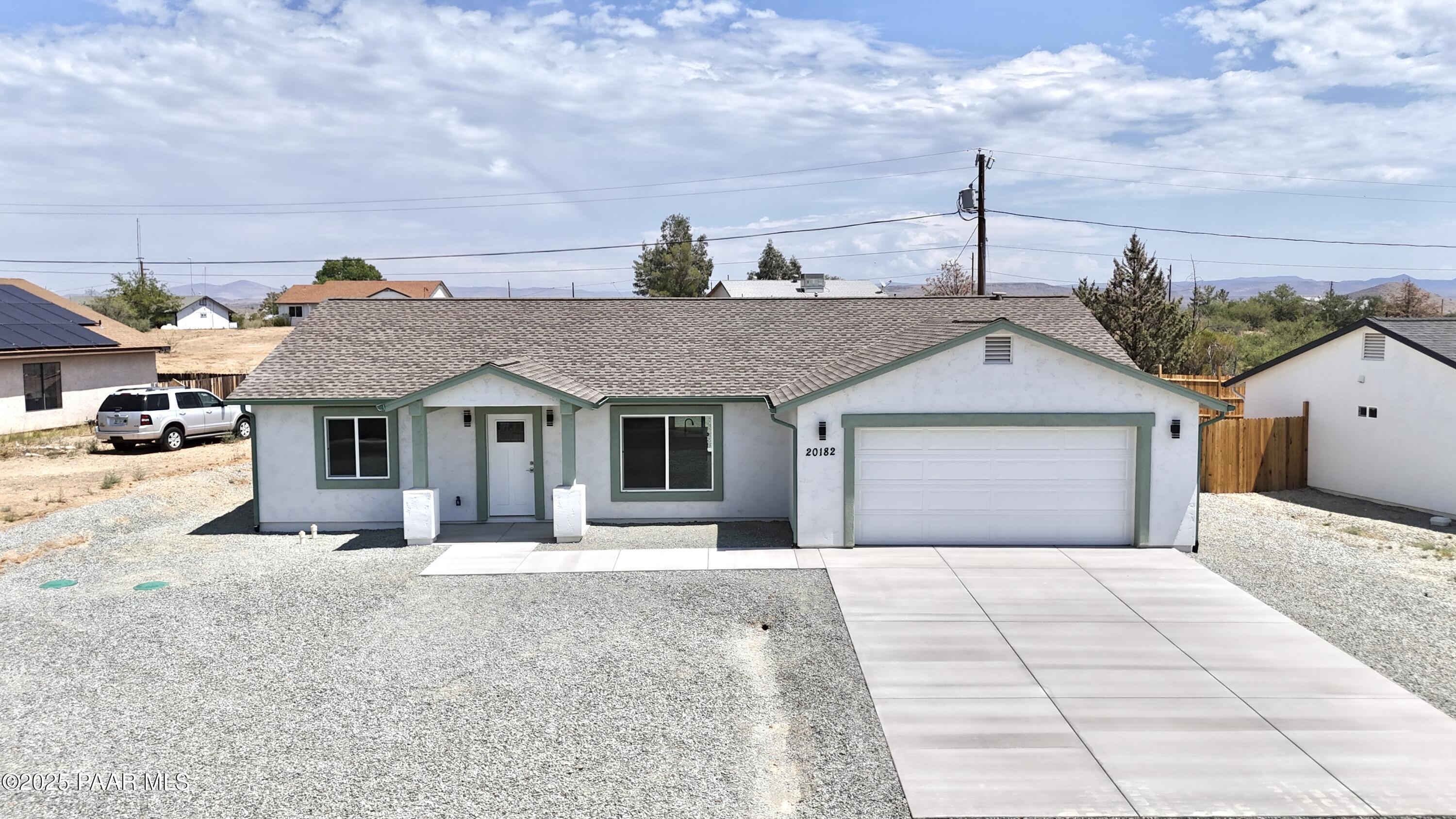 20182 East Mesa Verde Road Mayer, AZ 86333 - Photo 2 of 17 a front view of a house with a outdoor space