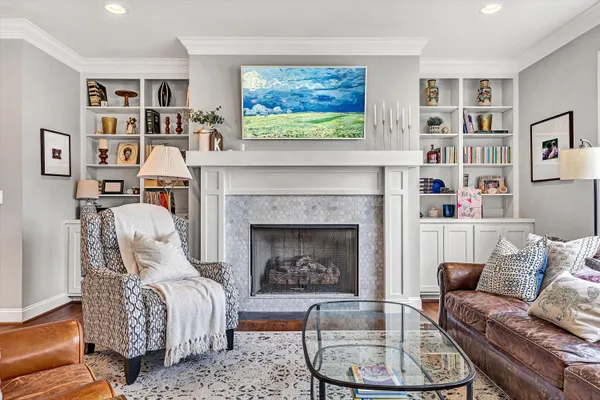 a living room with furniture and a fireplace