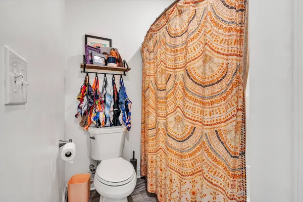 a white toilet sitting next to a bathroom sink