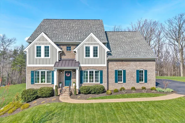 front view of a house with a yard