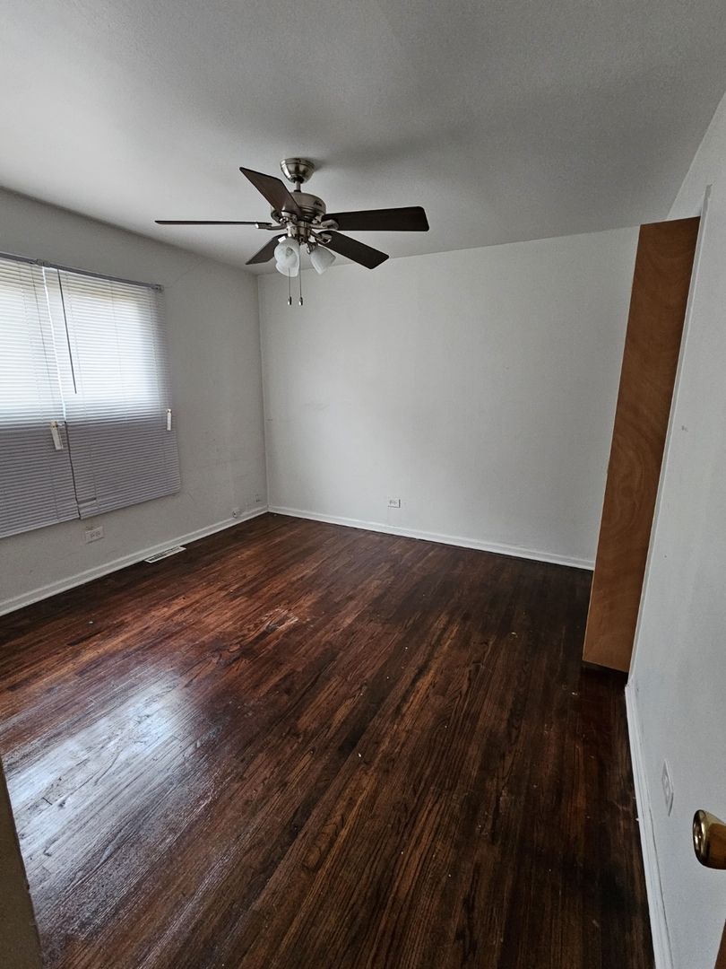 2105 171st Street Hazel Crest, IL 60429 - Photo 4 of 11 wooden floor in an empty room