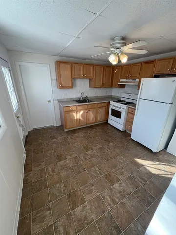 a large bathroom with a large tub and sink
