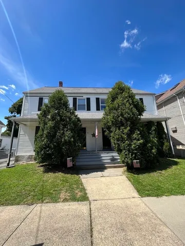 a view of house with yard