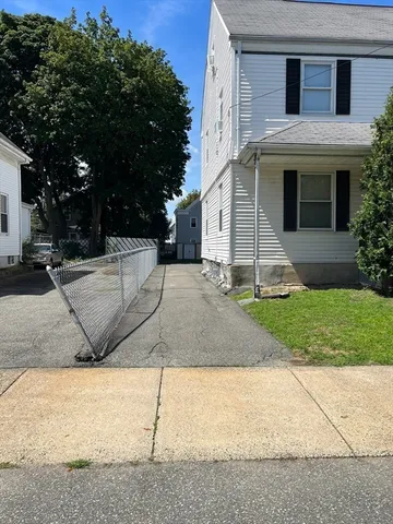a view of a house with a street
