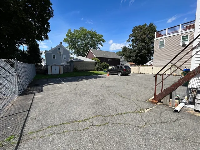 a view of green field with house in the background