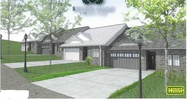 a view of a house with a yard and fence