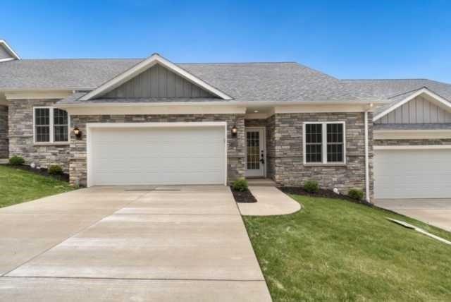 26 Pinehurst Place, Unit 26 Beaver, PA 15009 - Photo 2 of 10 a front view of a house with a yard and garage