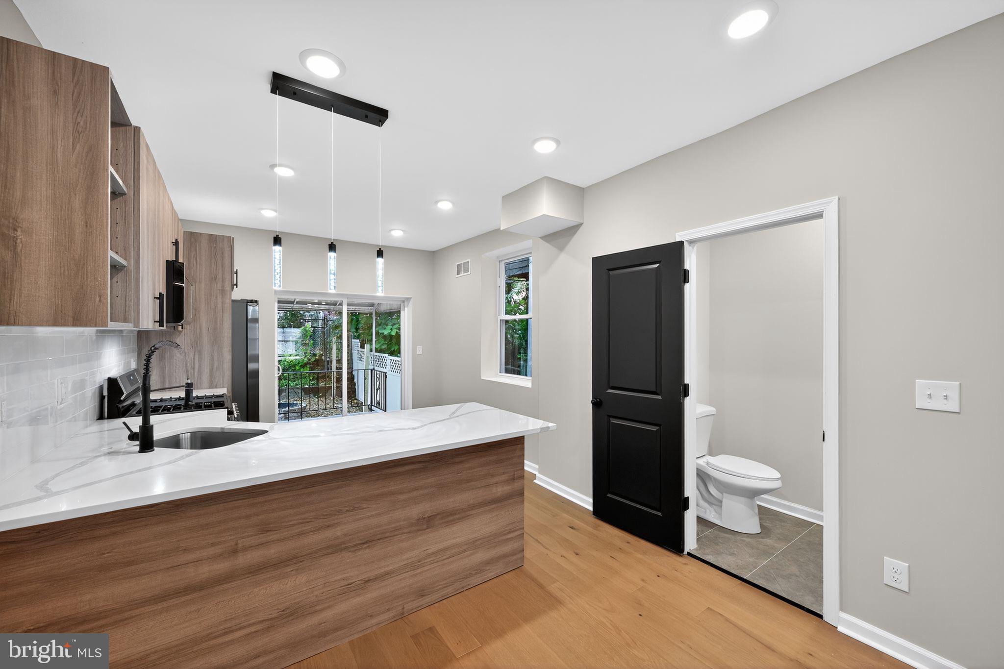 6019 Wharton Street Philadelphia, PA 19143 - Photo 11 of 30 Modern kitchen with sleek design elements.