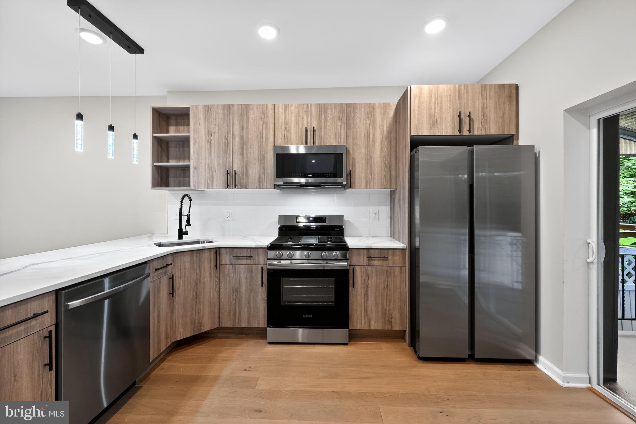 6019 Wharton Street Philadelphia, PA 19143 - Photo 13 of 30 Modern kitchen with sleek finishes.