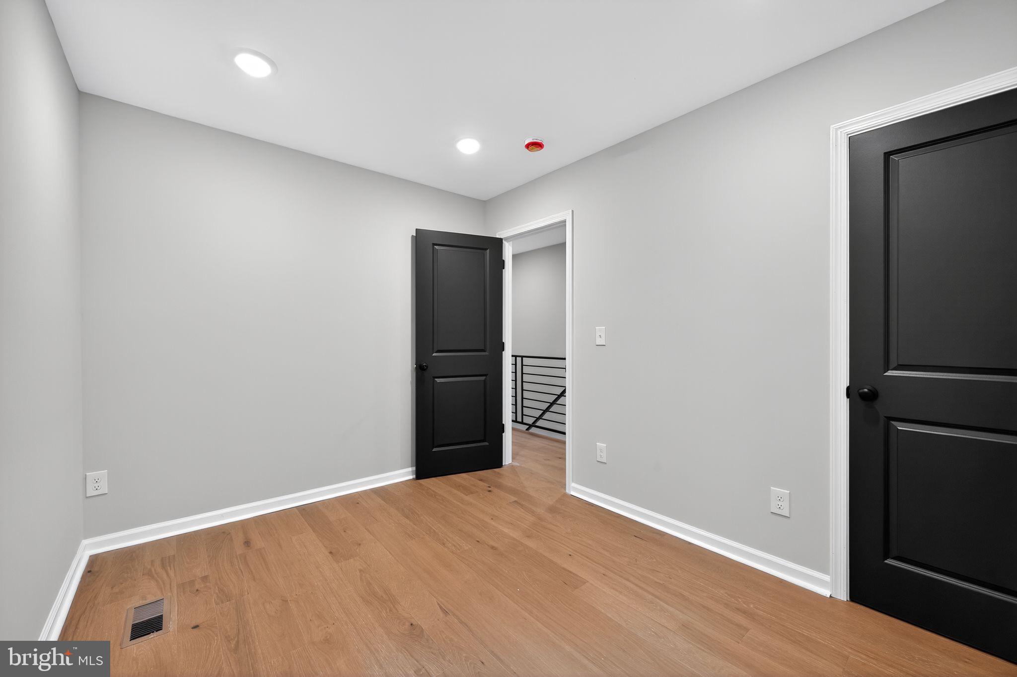 6019 Wharton Street Philadelphia, PA 19143 - Photo 14 of 30 Modern space with sleek black doors.