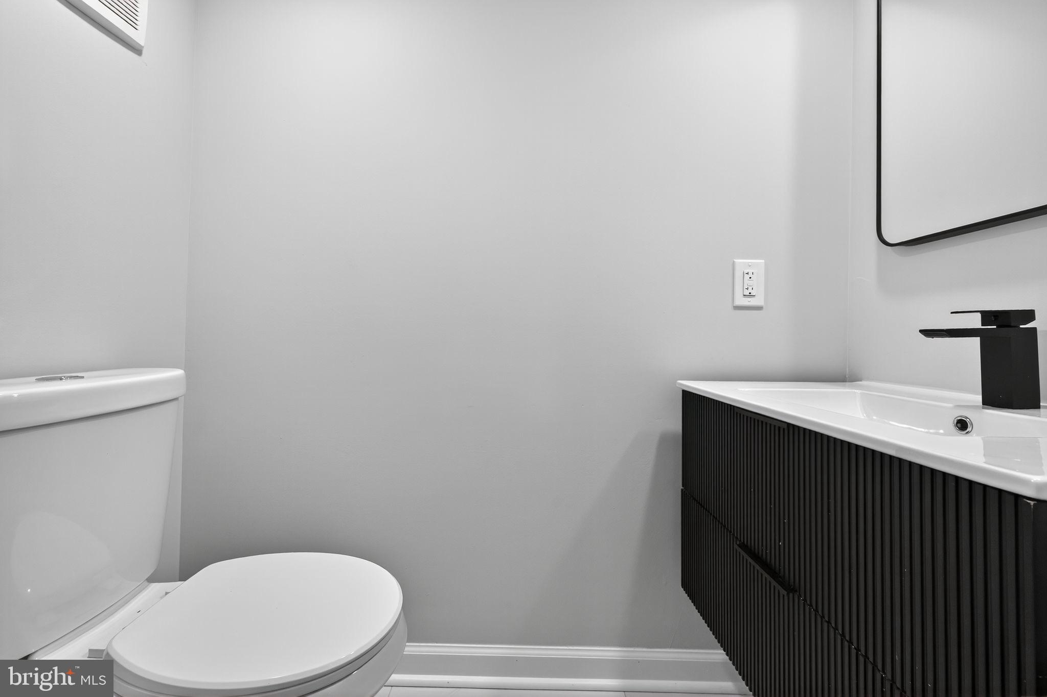 6019 Wharton Street Philadelphia, PA 19143 - Photo 20 of 30 Sleek modern bathroom with minimalist design.