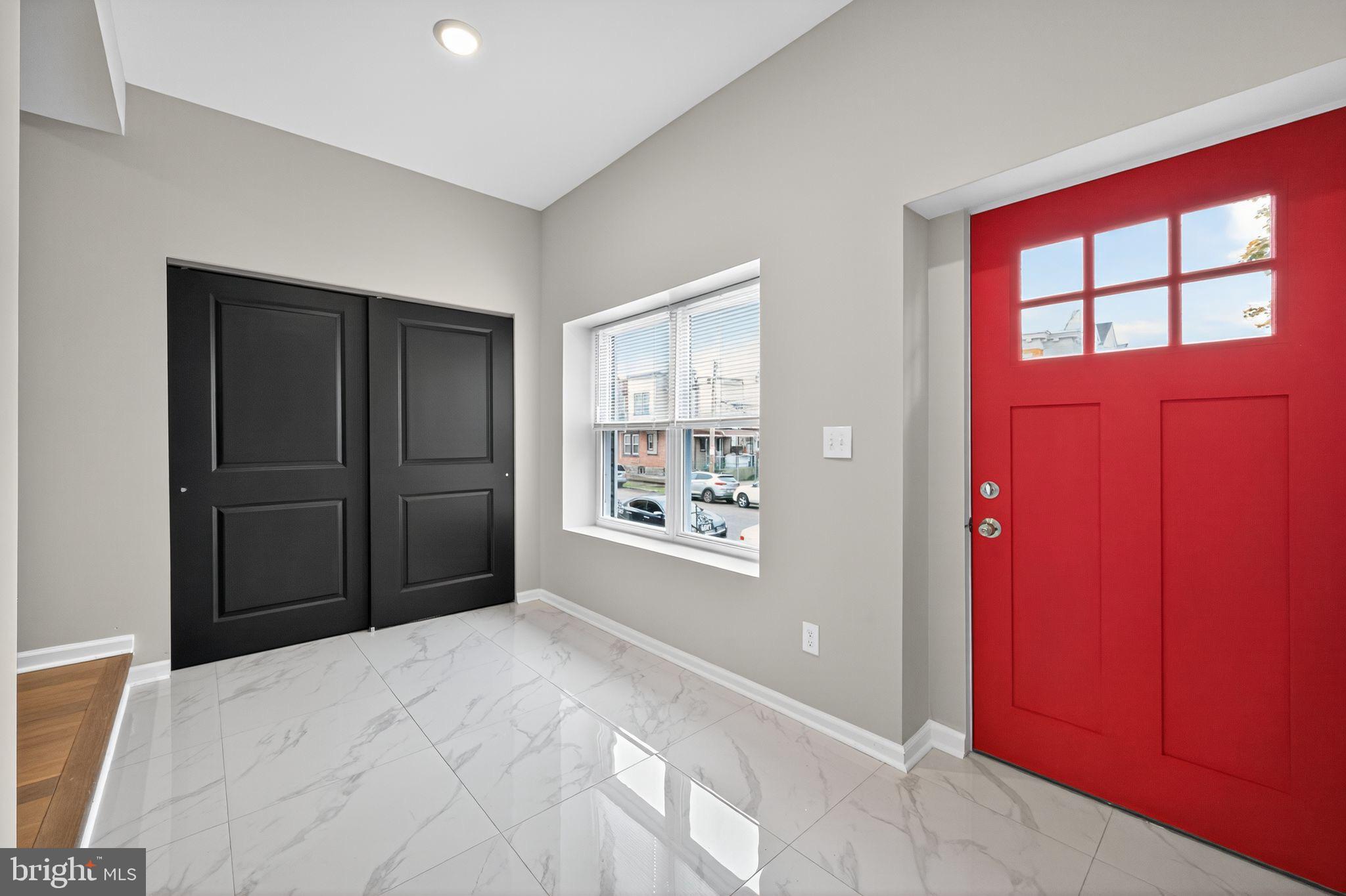 6019 Wharton Street Philadelphia, PA 19143 - Photo 2 of 30 Vibrant entryway with bold red door.