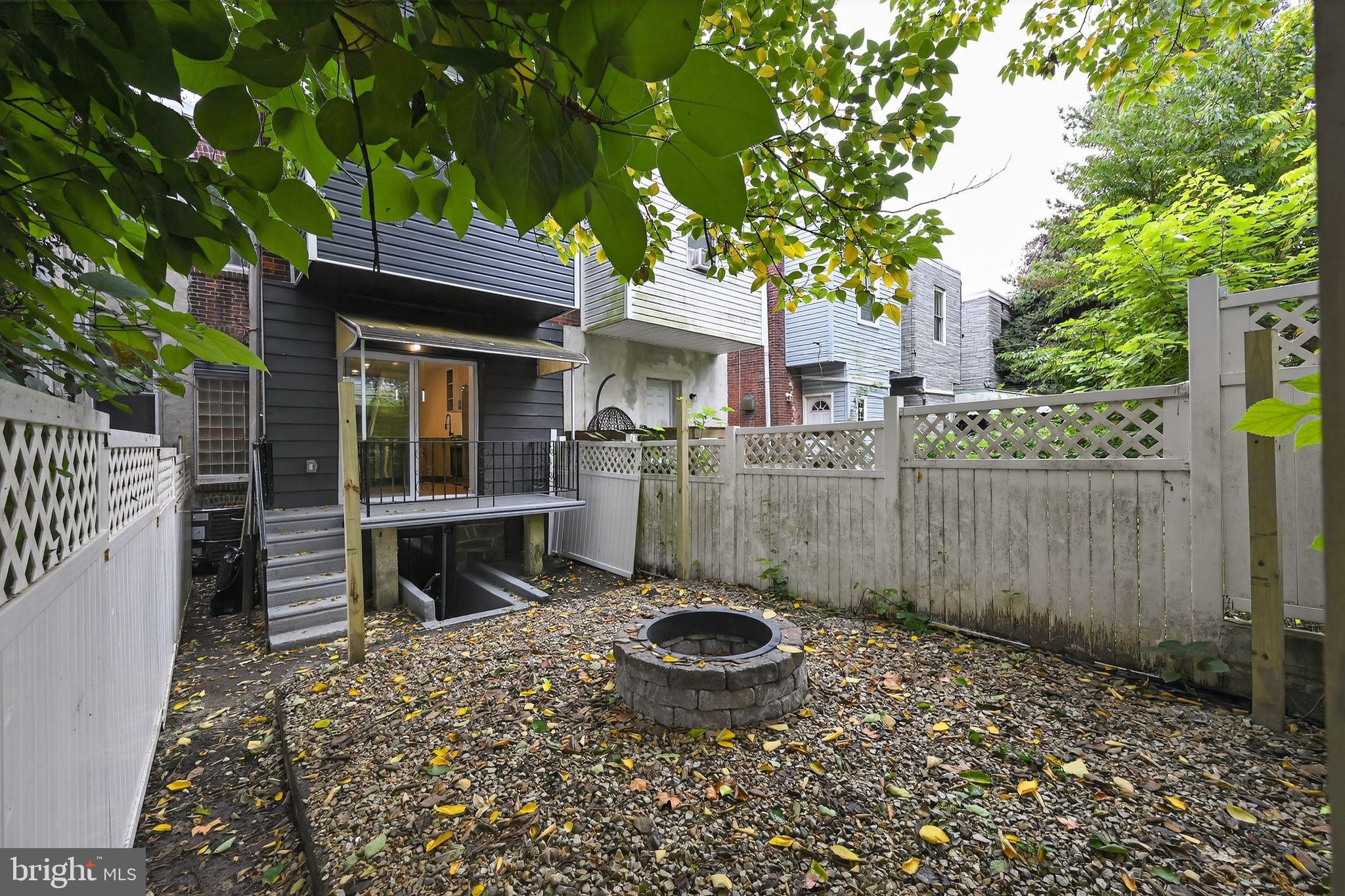 6019 Wharton Street Philadelphia, PA 19143 - Photo 27 of 30 Charming backyard retreat with fire pit.