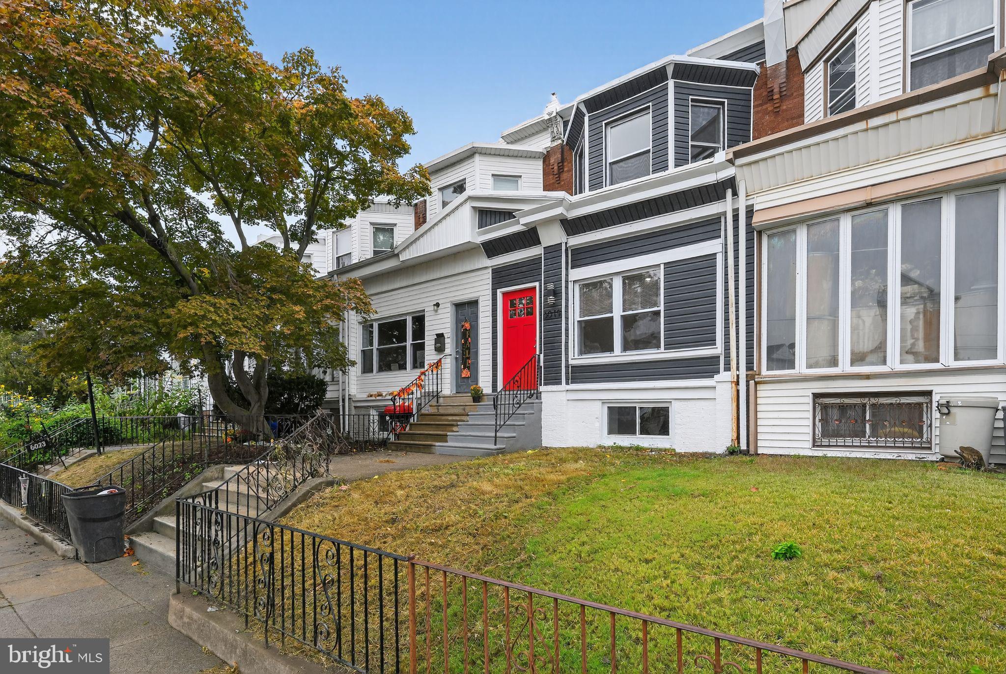 6019 Wharton Street Philadelphia, PA 19143 - Photo 29 of 30 Charming home with vibrant red door.