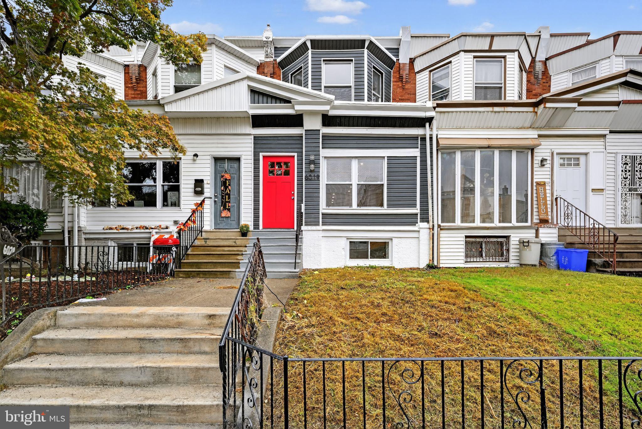 6019 Wharton Street Philadelphia, PA 19143 - Photo 30 of 30 Charming home with vibrant red door.