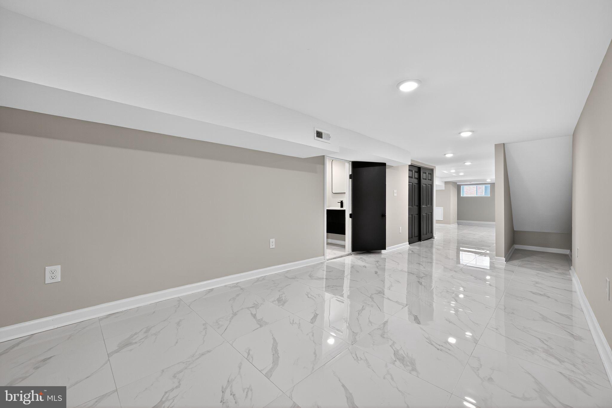 6019 Wharton Street Philadelphia, PA 19143 - Photo 7 of 30 Spacious, modern basement with sleek finishes.