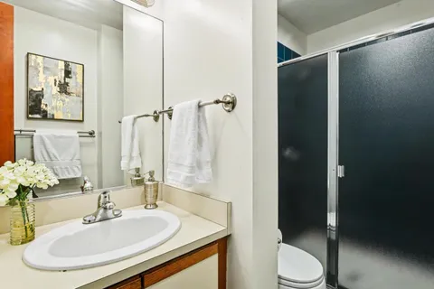 a bedroom with a bed and dresser