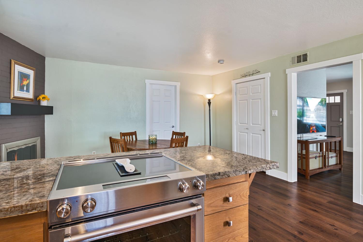 5422 Earnell Street Carmichael, CA 95608 - Photo 18 of 39 a view of a kitchen with a stove wooden floor and a kitchen space