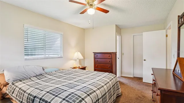 a bathroom with a sink toilet a mirror and shower