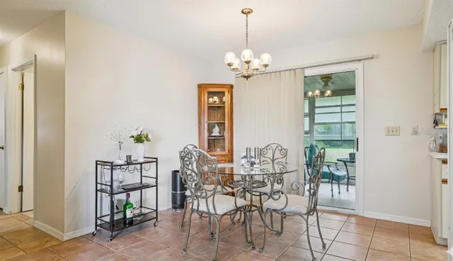 a kitchen with stainless steel appliances white cabinets and a window