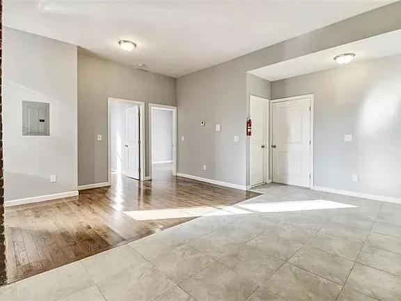 a view of a livingroom with wooden floor