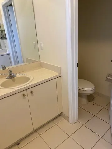 a bathroom with a sink toilet and vanity