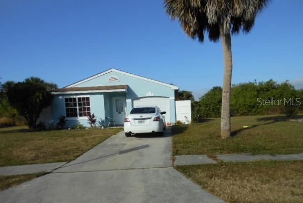 505 Ricold Terrace Port Charlotte, FL 33954 - Photo 3 of 3 a front view of a house with garden