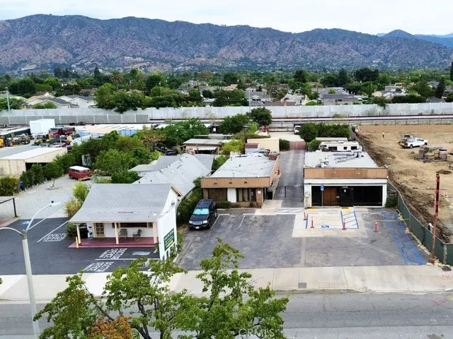 an aerial view of residential houses and outdoor space
