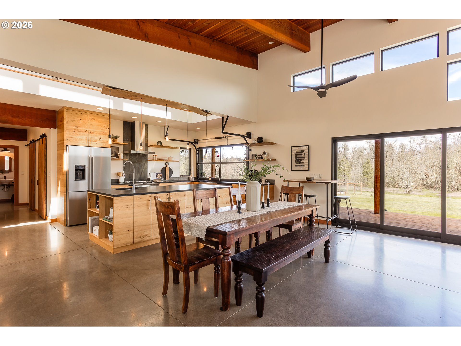 85535 Lancer Lane Eugene, OR 97405 - Photo 12 of 45 a dining room with furniture and a floor to ceiling window