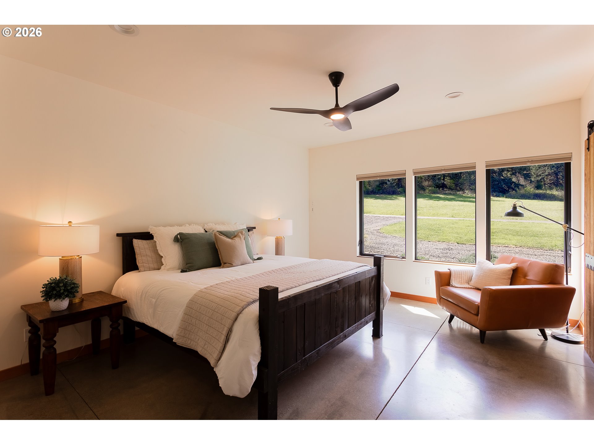 85535 Lancer Lane Eugene, OR 97405 - Photo 21 of 45 a spacious bedroom with a bed and a couch
